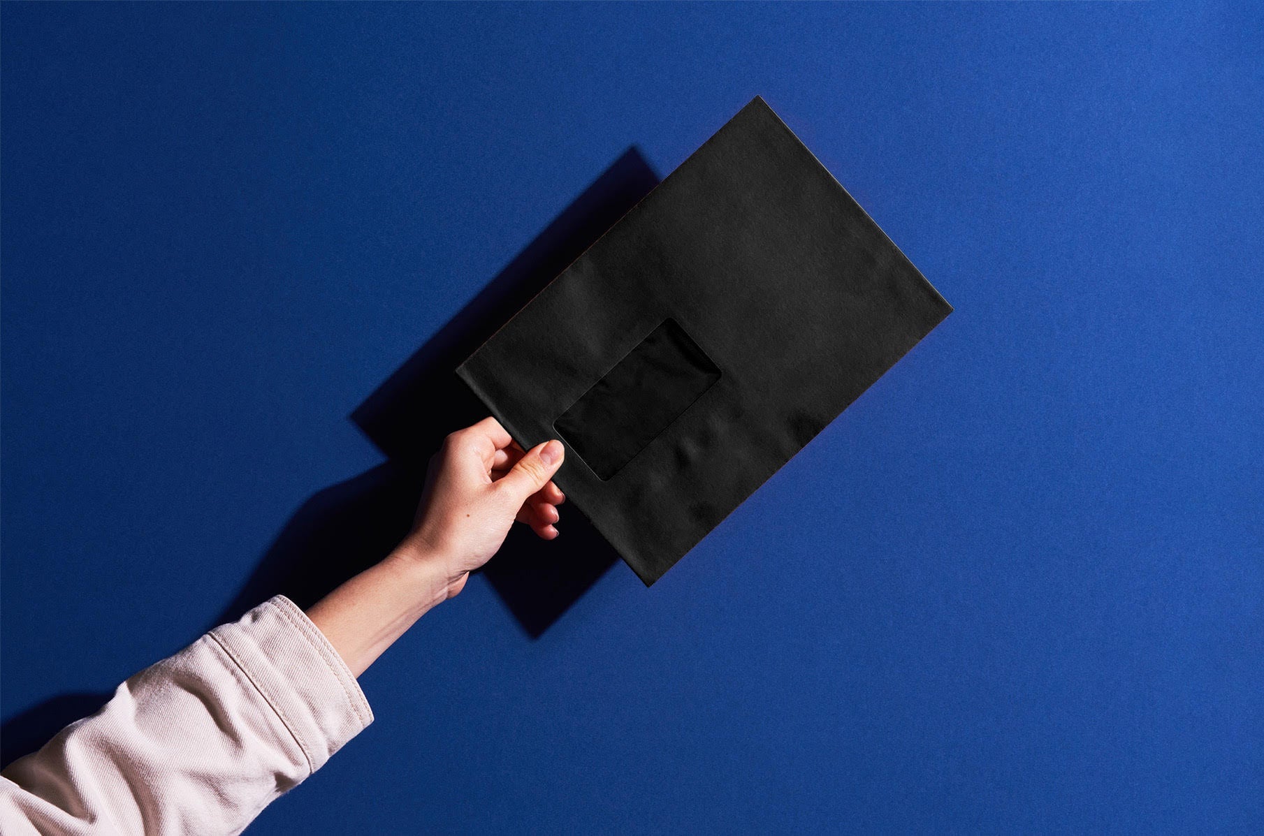 black envelope on blue background